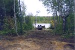 The boat is examined, information and photos sent to Steve Briggs of Owen Sound, he confirms that it is a Russel Brothers Aliigator from the mid 1920's. A road must be cleared.